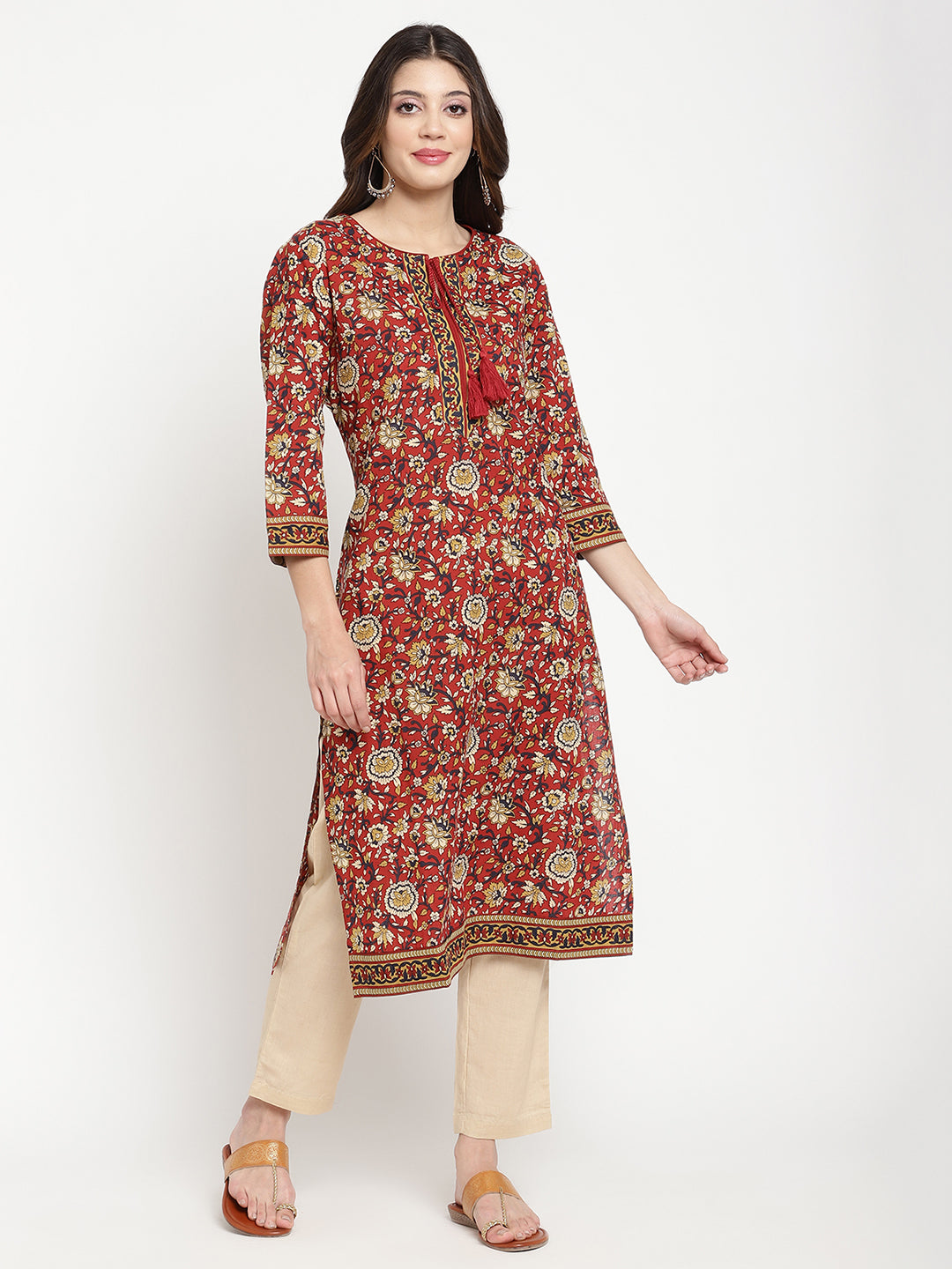 Model standing and wearing a rust Kurta with a straight-fit.