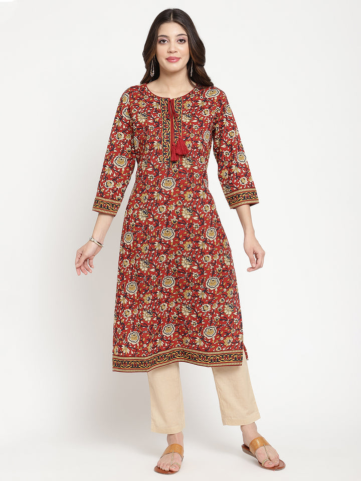 Model standing and wearing a rust Kurta with a straight-fit.