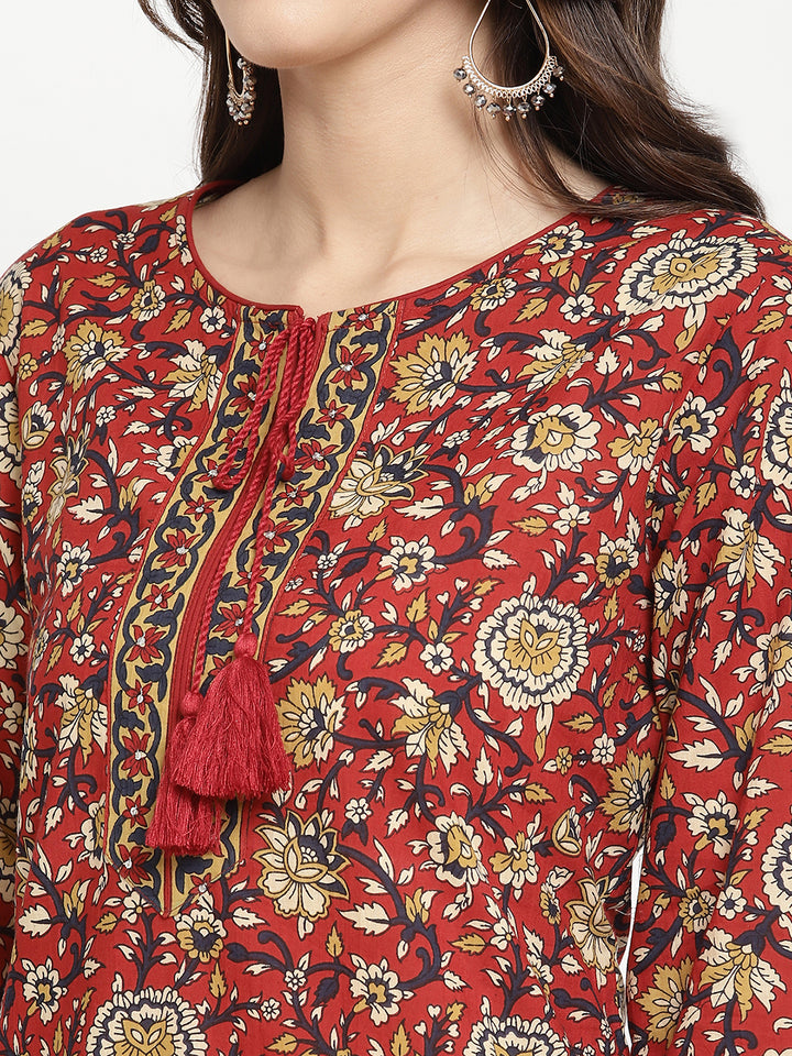 Model standing and wearing a rust Kurta with a straight-fit.