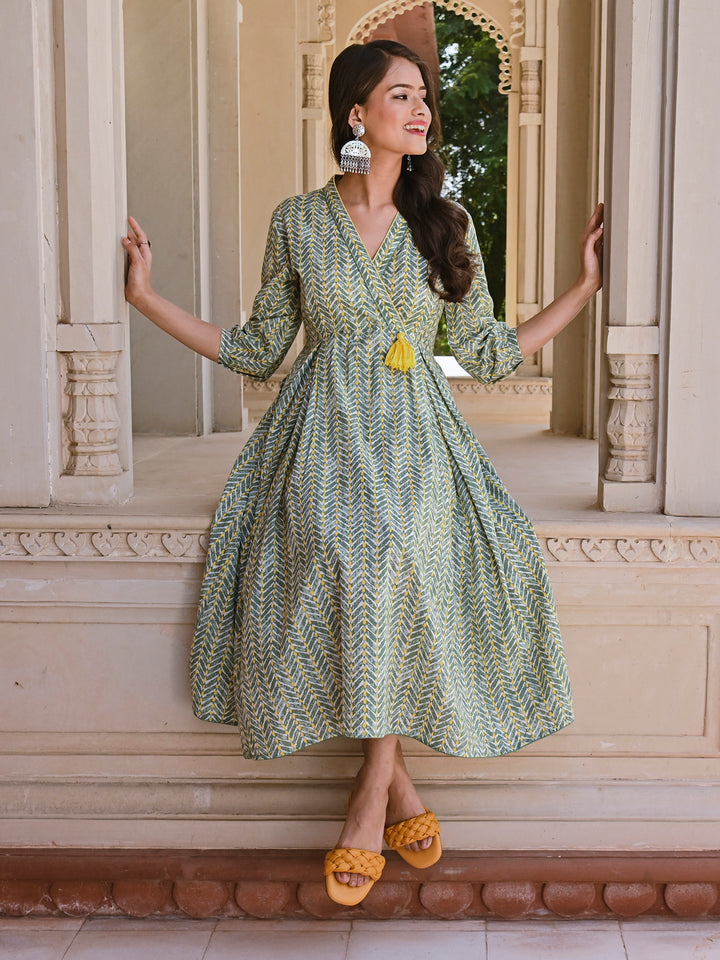 Woman posing in Savi's Cotton overlap Yoke sage Green Pleated Dress