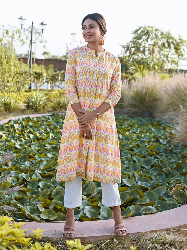 Woman posing in Peach Pink Rayon Ikat Printed Mandarin Collar Kurta