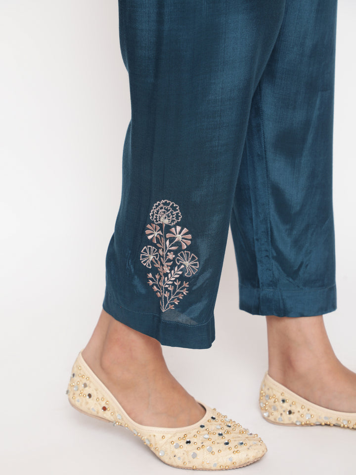 Woman posing in Savi’s Shantoon Embroidered Ethnic Rust Kurta with Contrast Pant Set