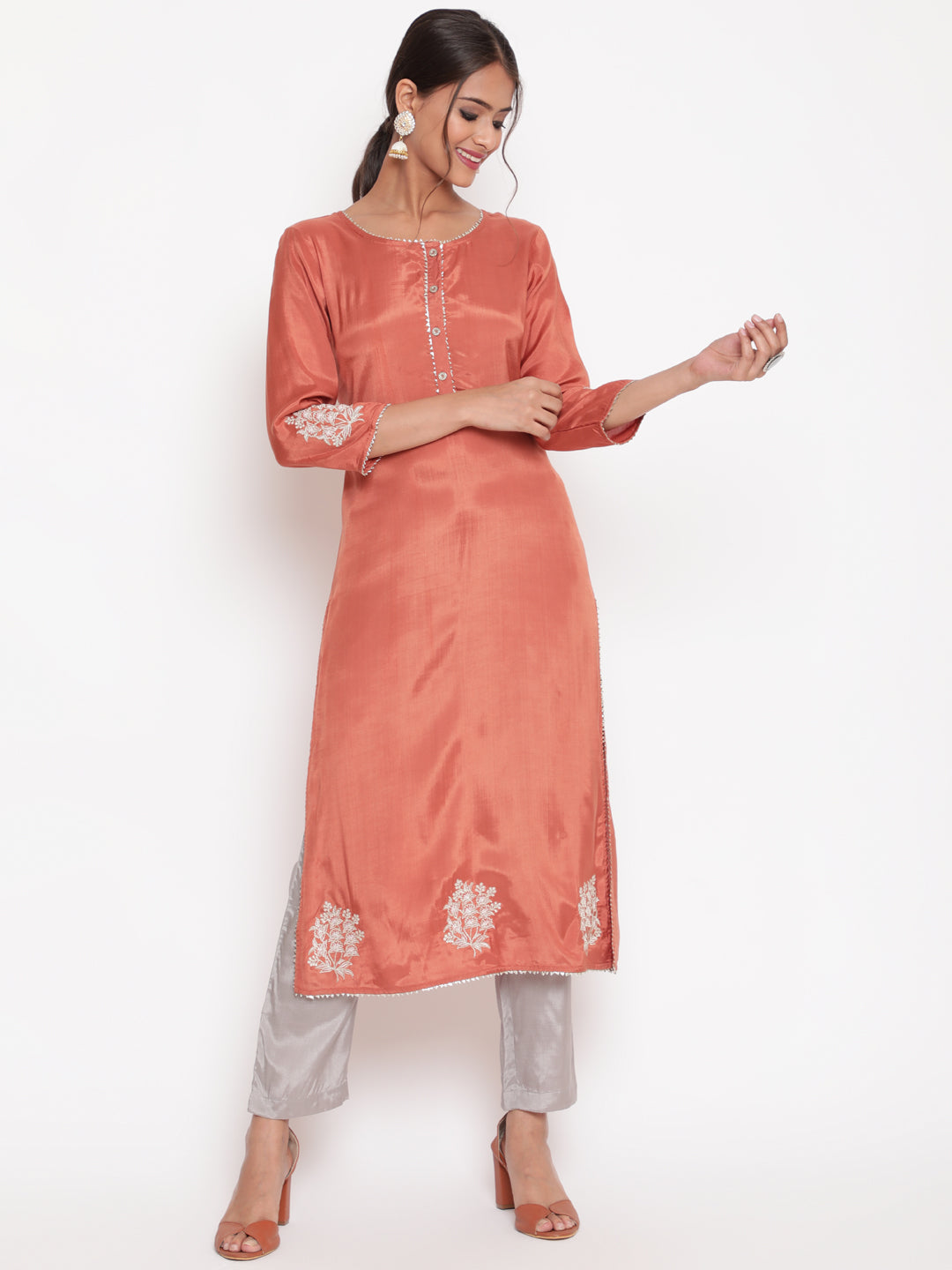 Woman posing in Rust Embroidered Straight Kurta Pant Set
