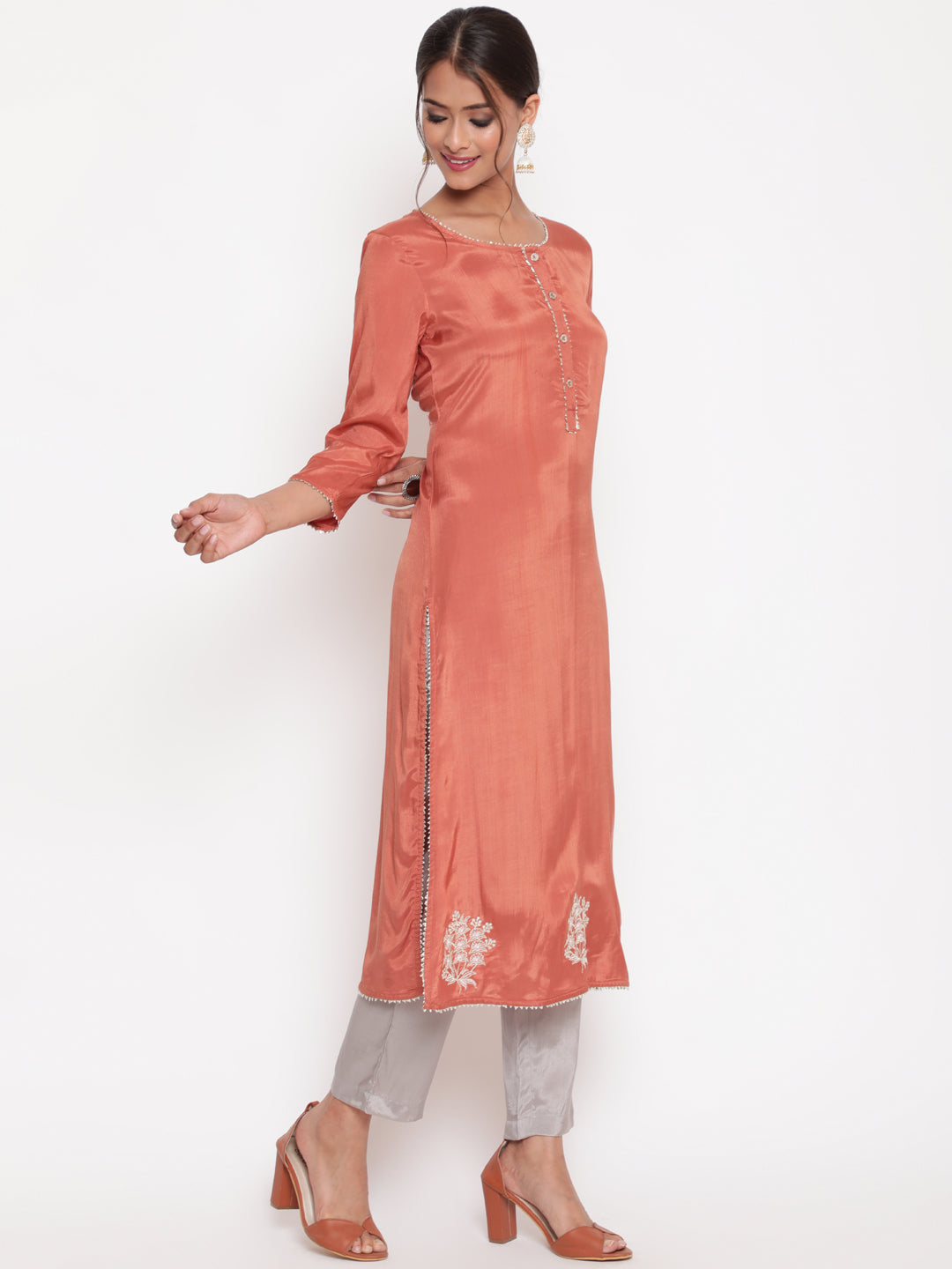 Woman posing in Rust Embroidered Straight Kurta Pant Set
