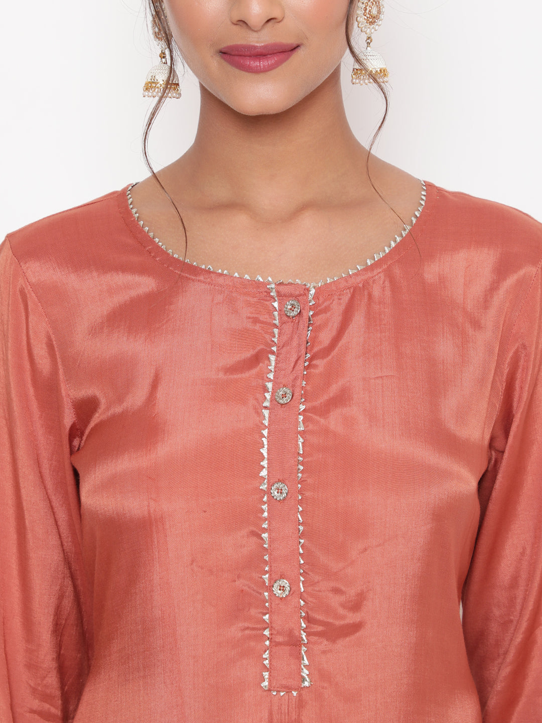 Woman posing in Rust Embroidered Straight Kurta Pant Set