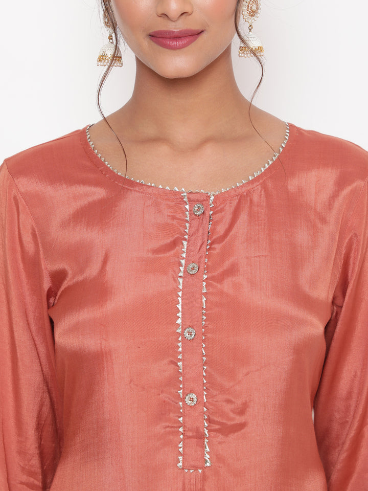 Woman posing in Rust Embroidered Straight Kurta Pant Set