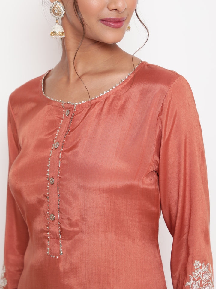 Woman posing in Rust Embroidered Straight Kurta Pant Set