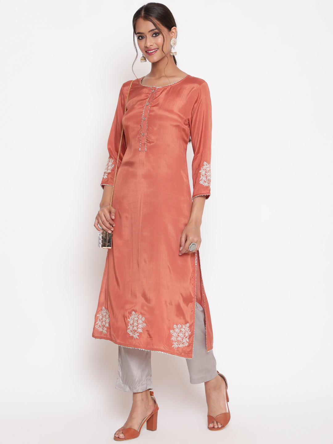 Woman posing in Rust Embroidered Straight Kurta Pant Set