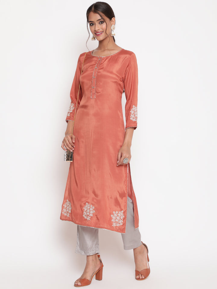 Woman posing in Rust Embroidered Straight Kurta Pant Set