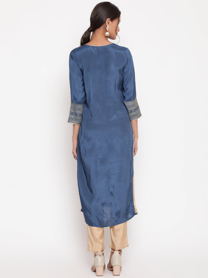 Woman posing in Blue Zari Embroidered Straight Kurta Pant Set