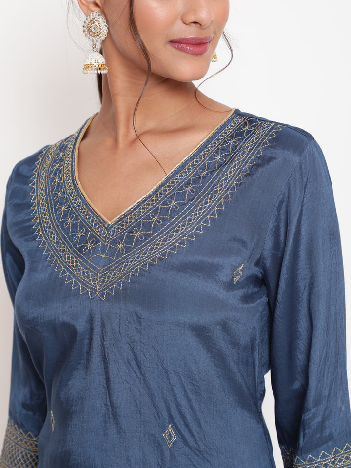 Woman posing in Blue Zari Embroidered Straight Kurta Pant Set