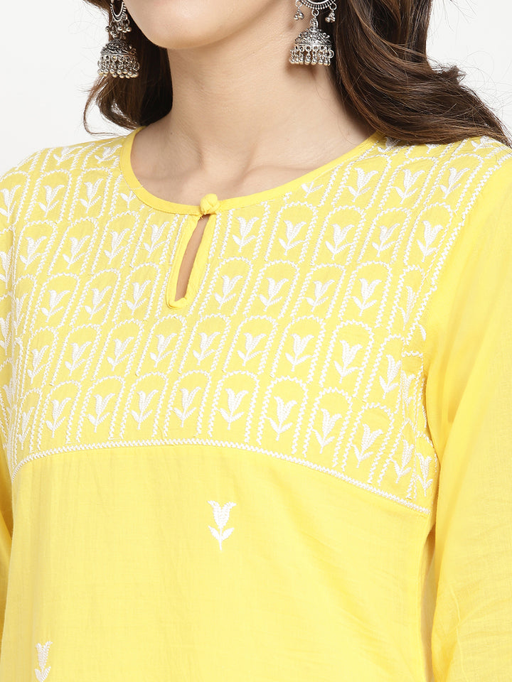Woman wearing Savi's yellow cotton Kurta.