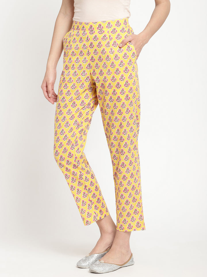 Woman wearing yellow pants made of cotton fabric.