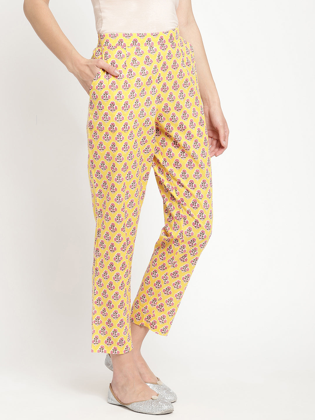 Woman wearing yellow pants made of cotton fabric.