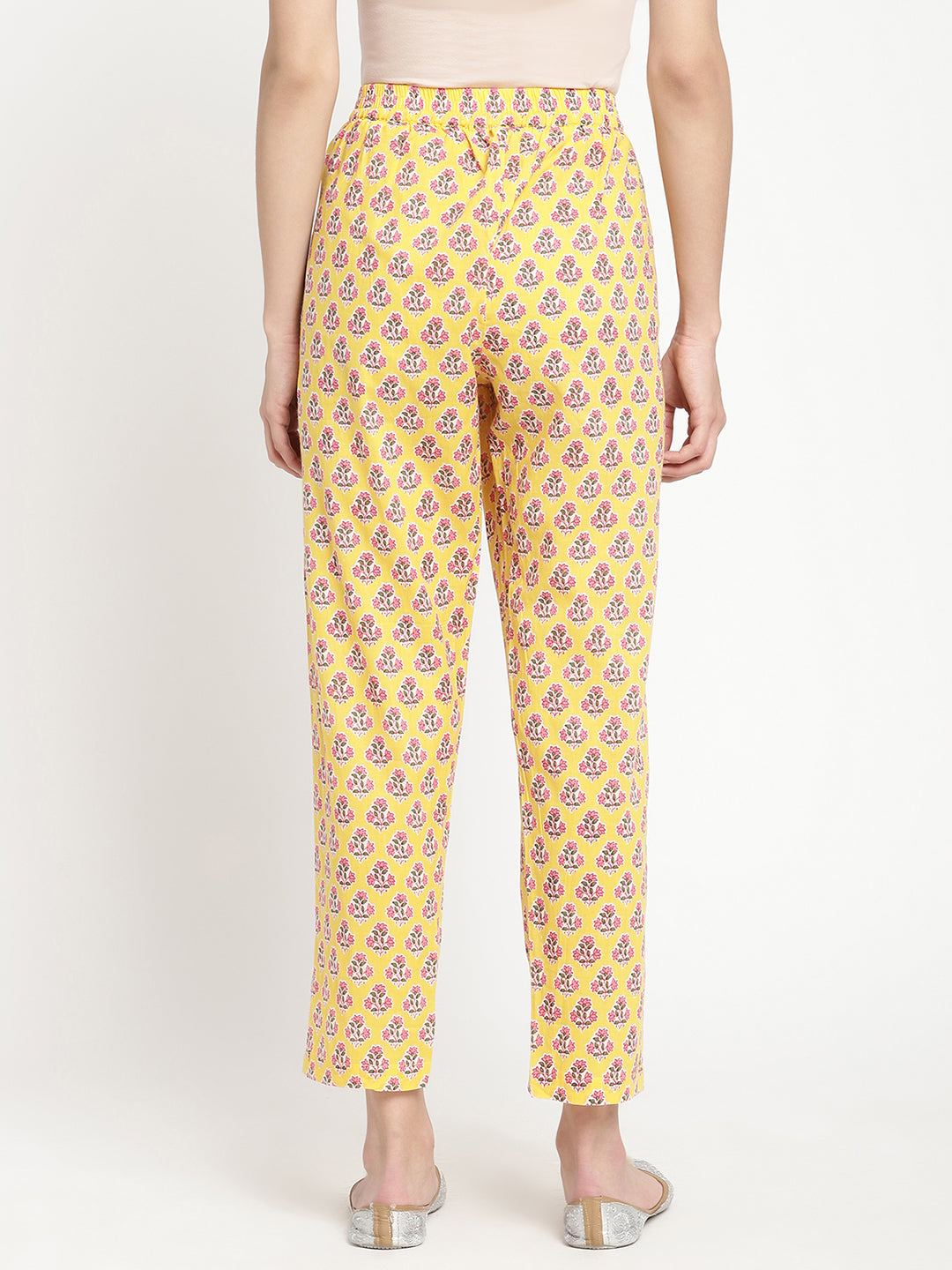 Woman wearing yellow pants made of cotton fabric.