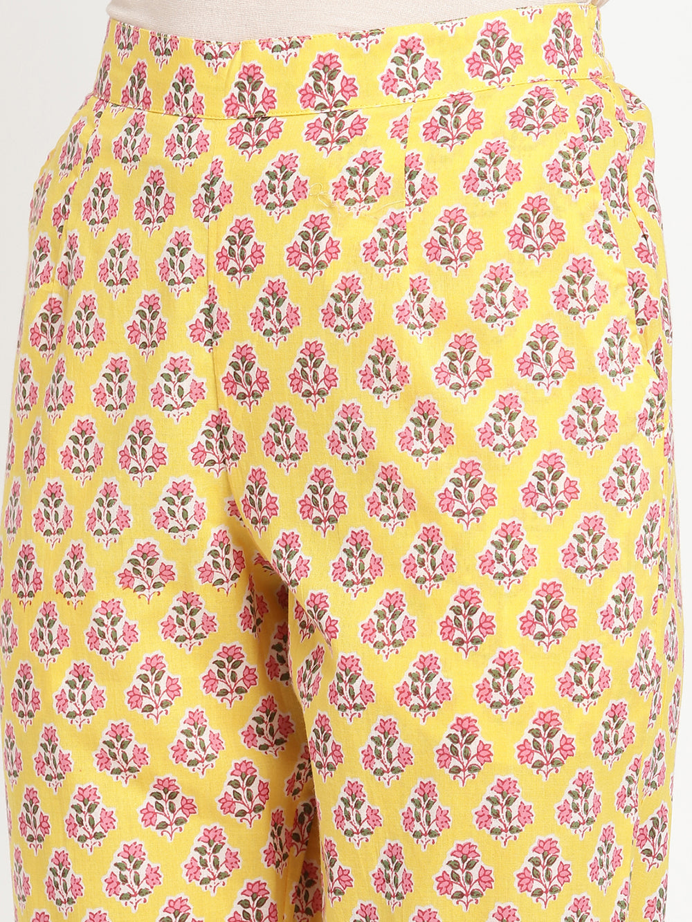 Woman wearing yellow pants made of cotton fabric.