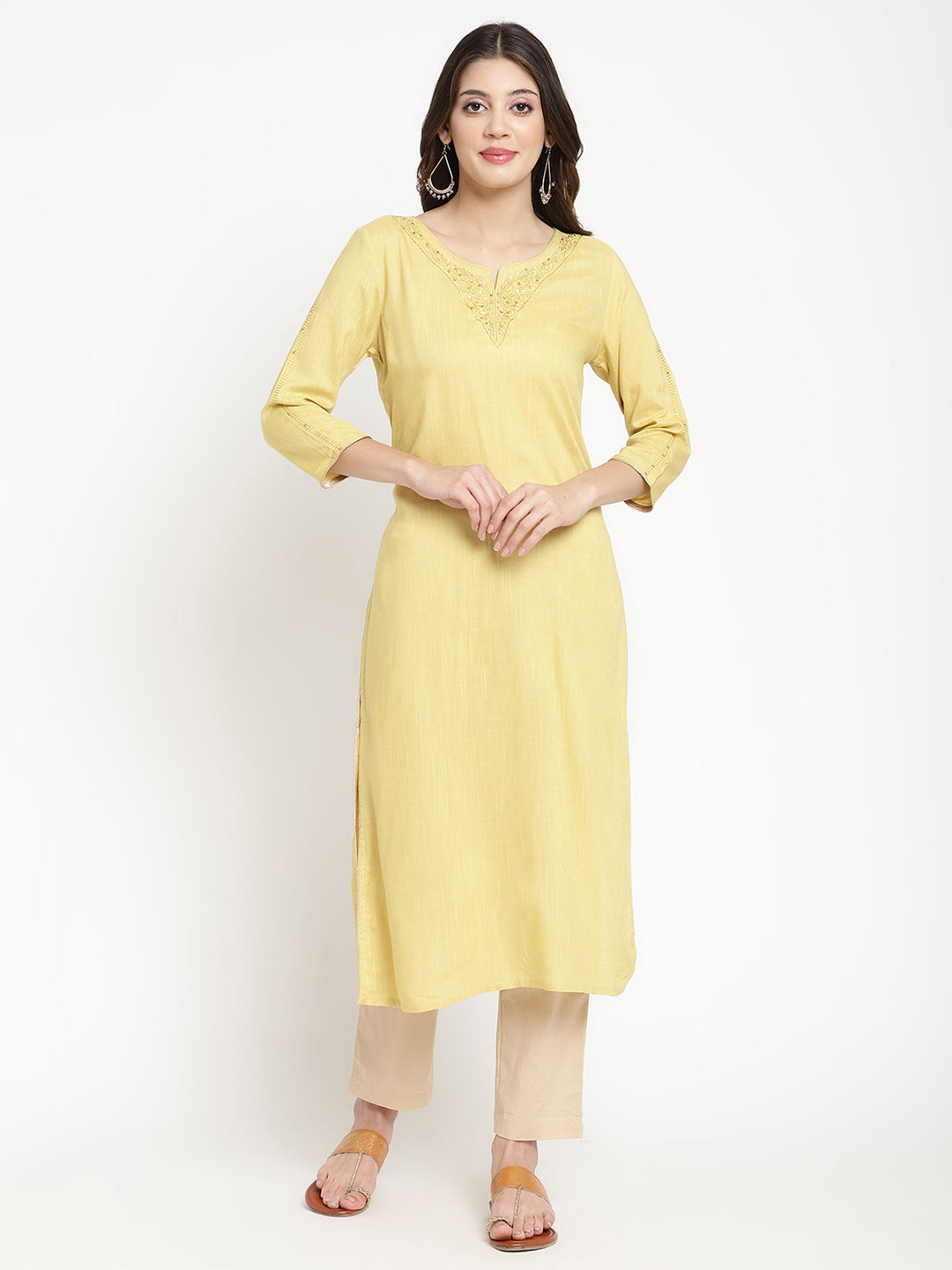 Woman wearing a yellow rayon, straight-fit Kurta.