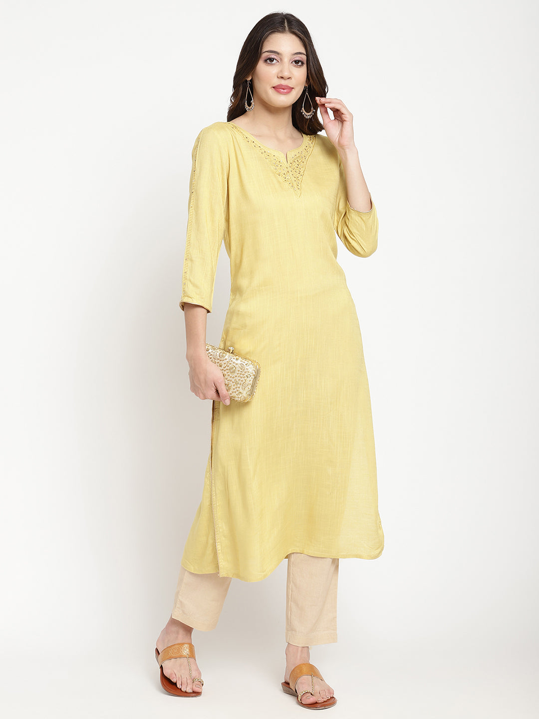 Woman wearing a yellow rayon, straight-fit Kurta.