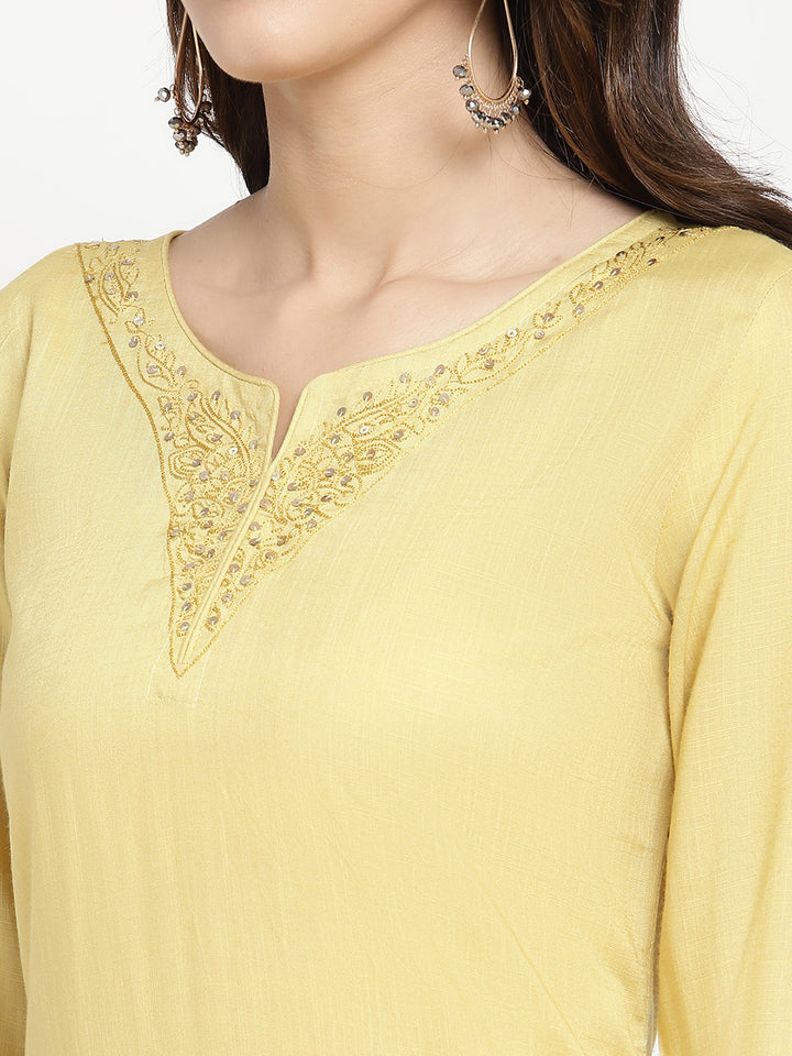 Woman wearing a yellow rayon, straight-fit Kurta.