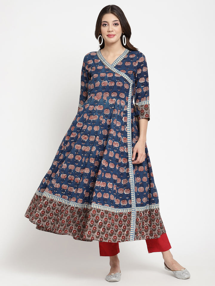 Woman posing in a blue Angrakha Anarkali Kurta. 