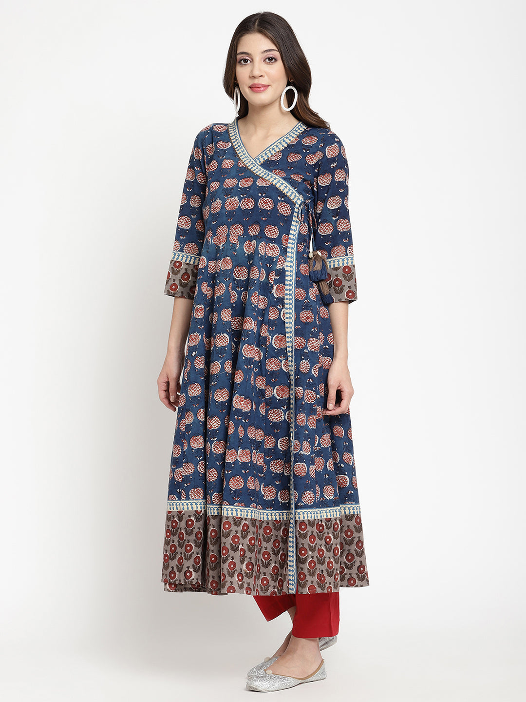 Woman posing in a blue Angrakha Anarkali Kurta. 