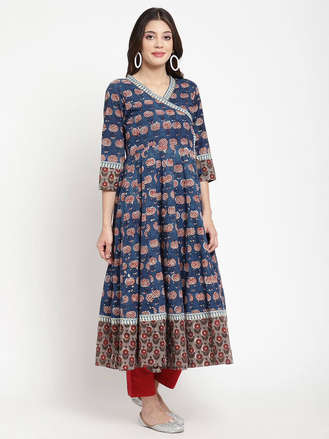 Woman posing in a blue Angrakha Anarkali Kurta. 