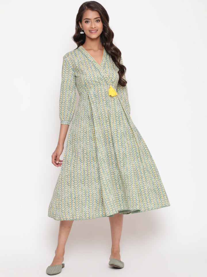 Woman posing in Savi's Cotton overlap Yoke sage Green Pleated Dress