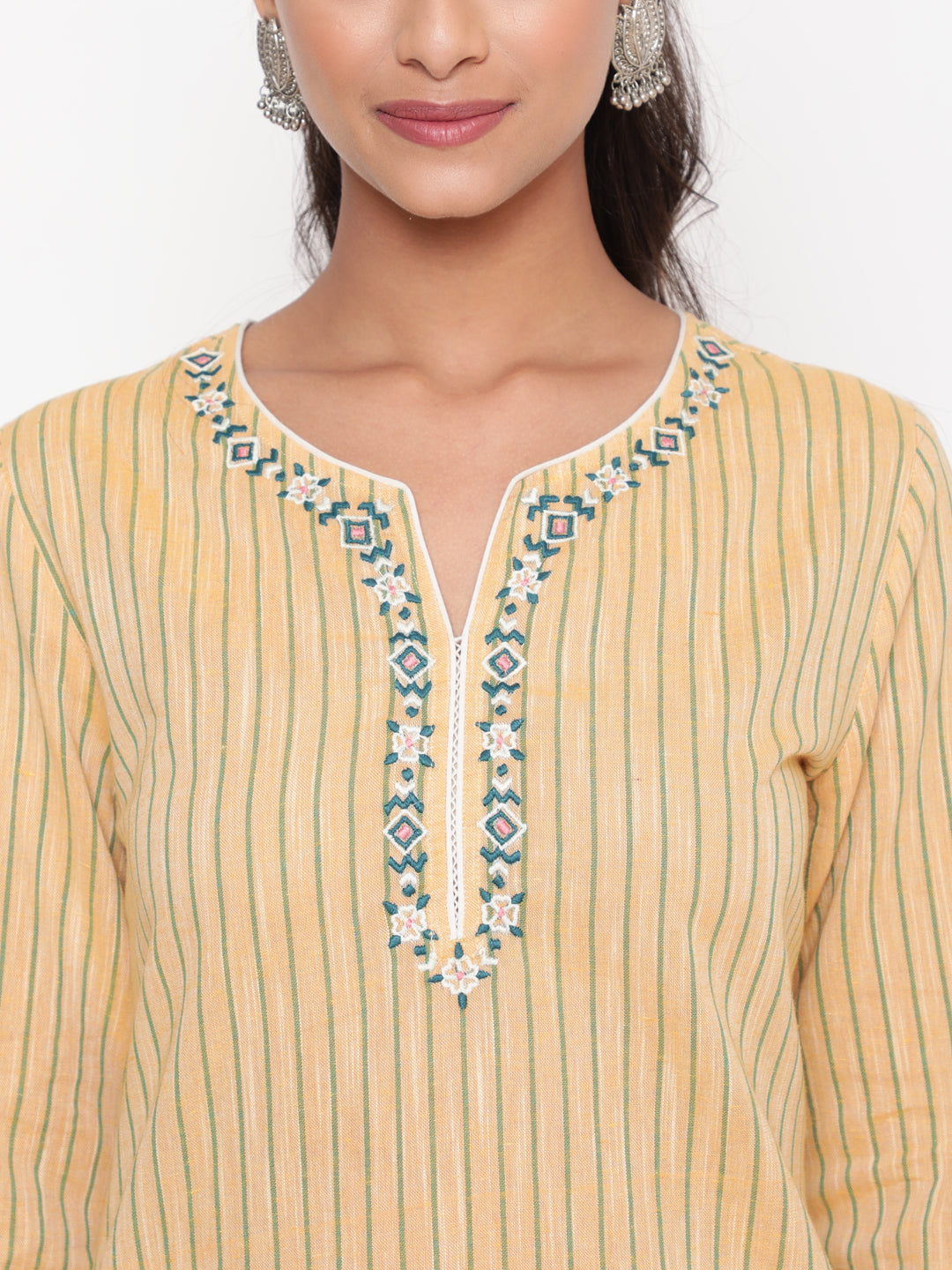 Woman posing in Savi's Cotton yarn dye Yellow Straight fit kurta With Pant