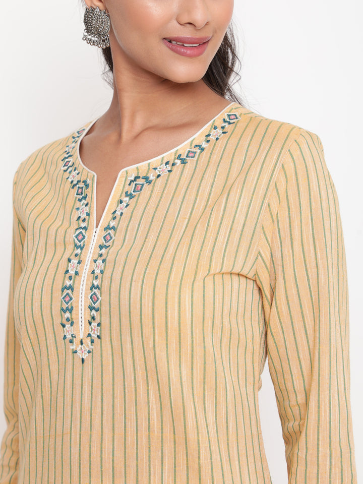 Woman posing in Savi's Cotton yarn dye Yellow Straight fit kurta With Pant