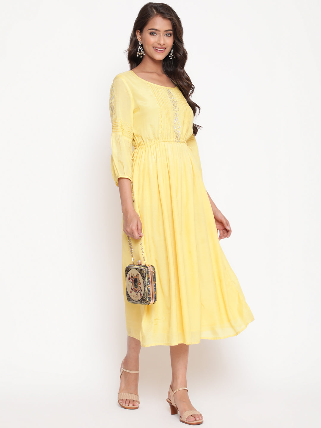 Woman posing in Embroidered Flared Tie Up Yellow Dress