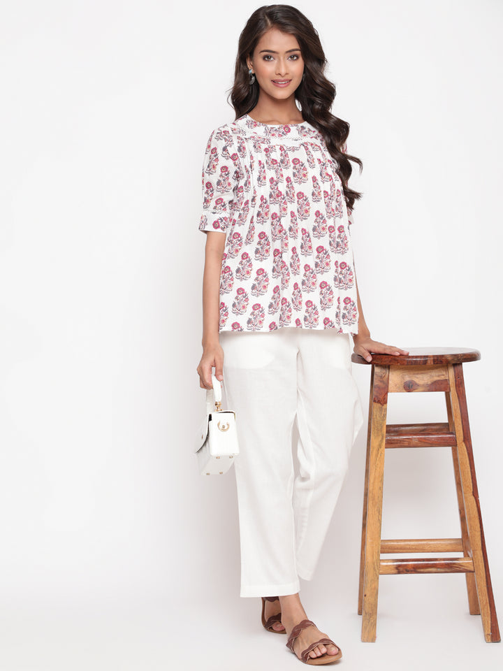 Woman posing in Savi's Cotton Printed White Pintuck Tunic