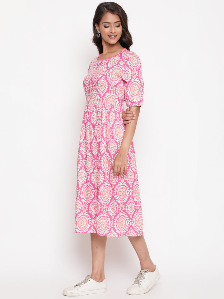 Woman posing in Savi's Designer Pink Ikat Printed Dress