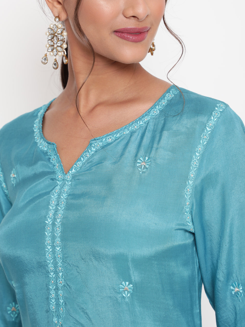 Woman posing in Savi’s Shantoon Embroidered straight Blue Kurta with Pink Pant