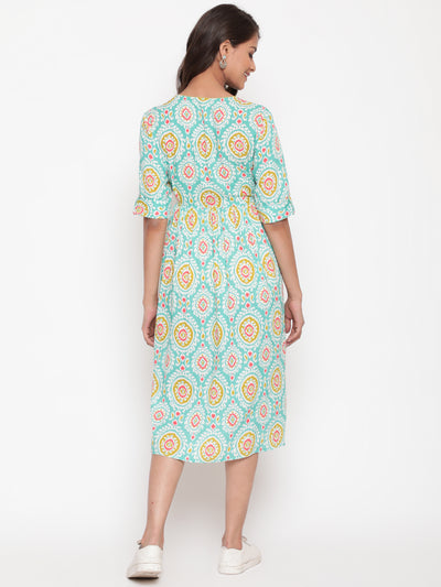 Woman posing in Mint Ikat Printed Knee Length Designer Dress