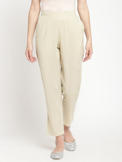 Full shot of straight-fit, off-white pants for women. 