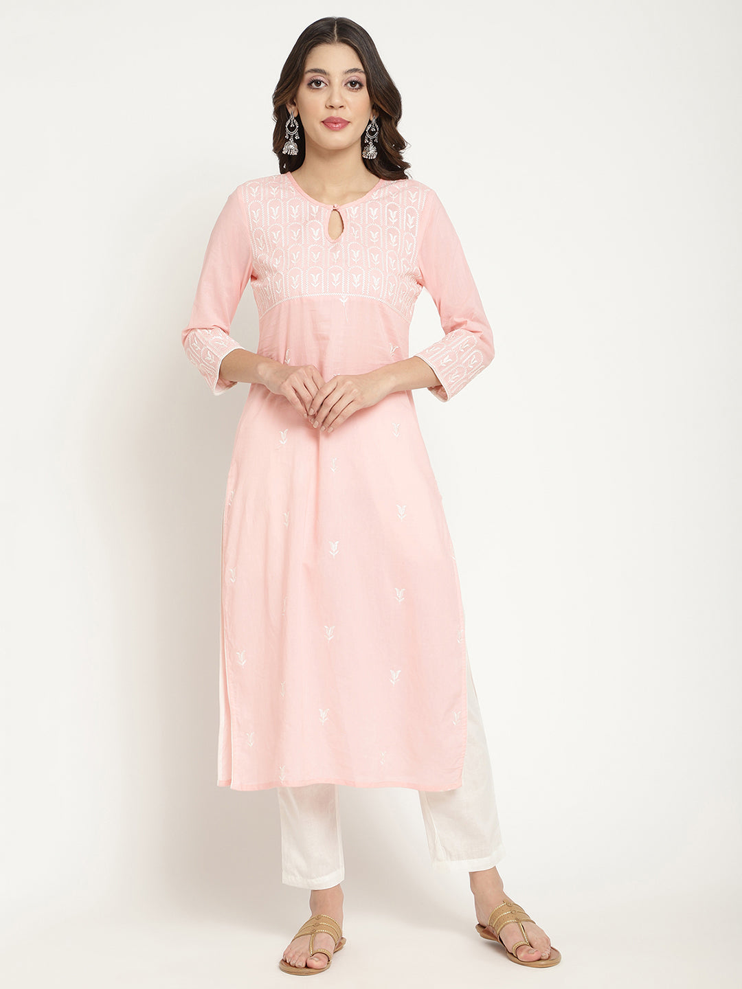 Model posing in a pink cotton embroidered Kurta. 