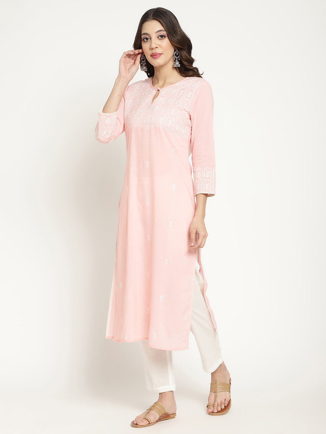 Model posing in a pink cotton embroidered Kurta. 