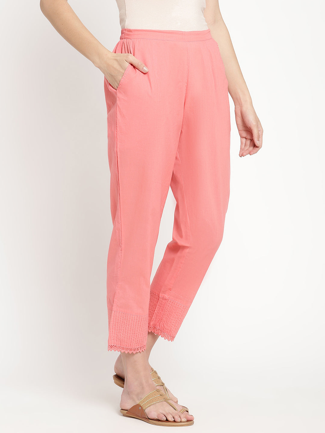 Model wearing pink cotton straight fit pants. 