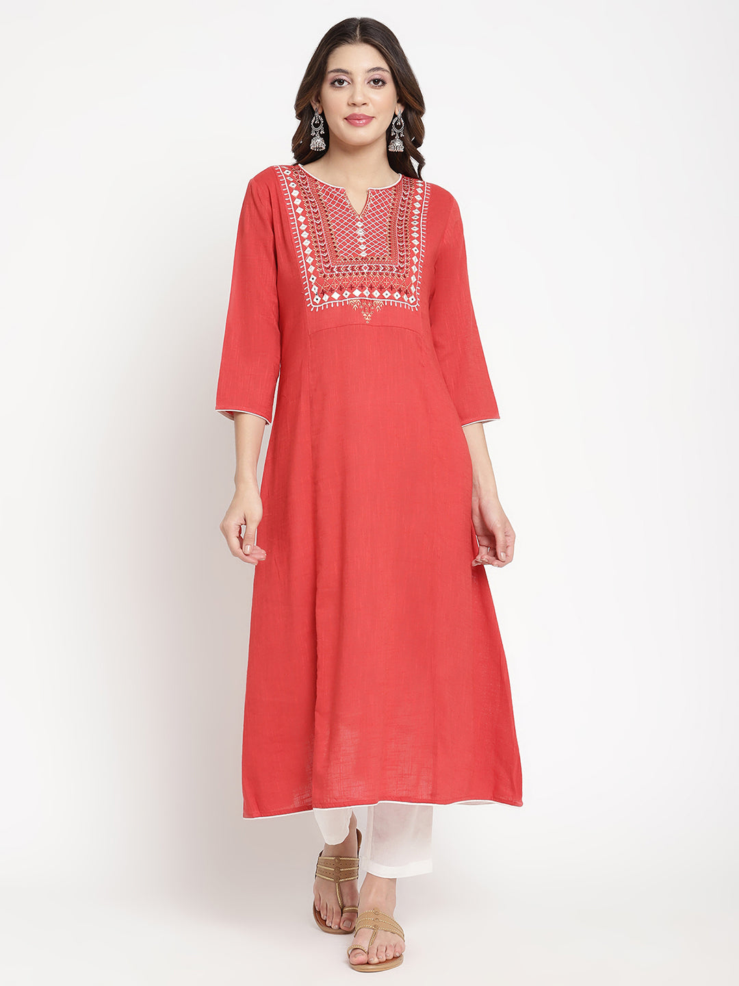 Woman wearing a red embroidered Kurta in an A-line silhouette. 
