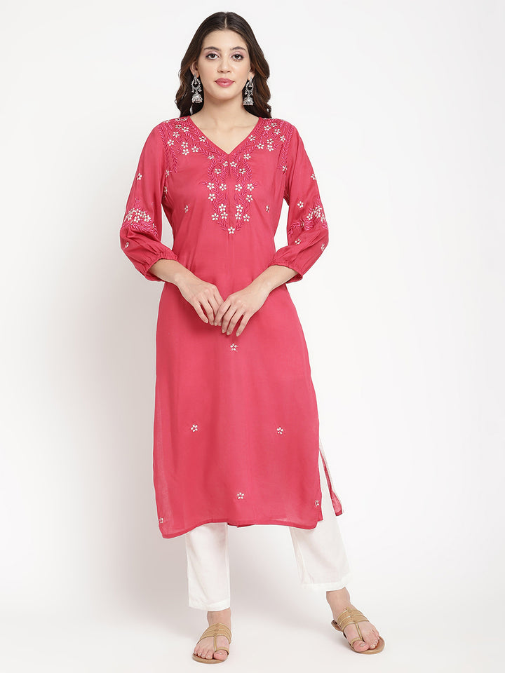 Woman standing in Rose Pink Embroidered A Line Kurta by Savi. 