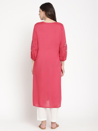 Woman standing in Rose Pink Embroidered A Line Kurta by Savi. 
