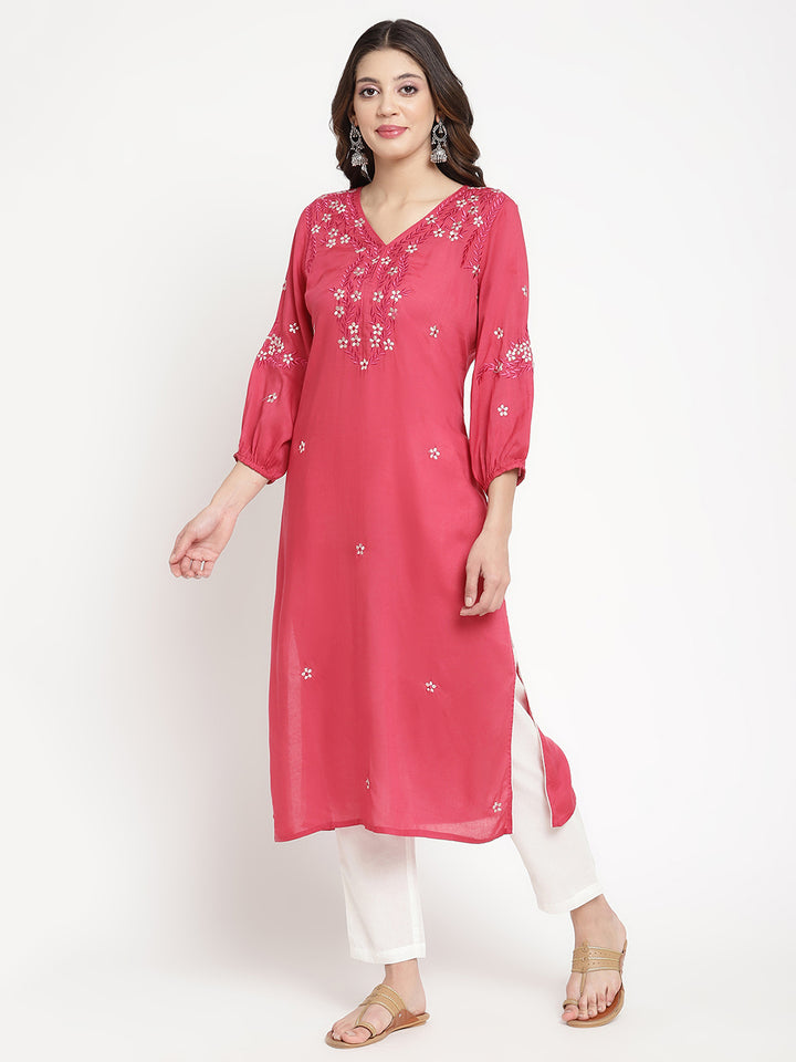 Woman standing in Rose Pink Embroidered A Line Kurta by Savi. 