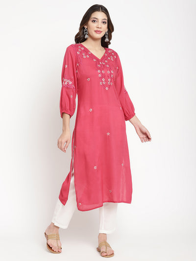 Woman standing in Rose Pink Embroidered A Line Kurta by Savi. 