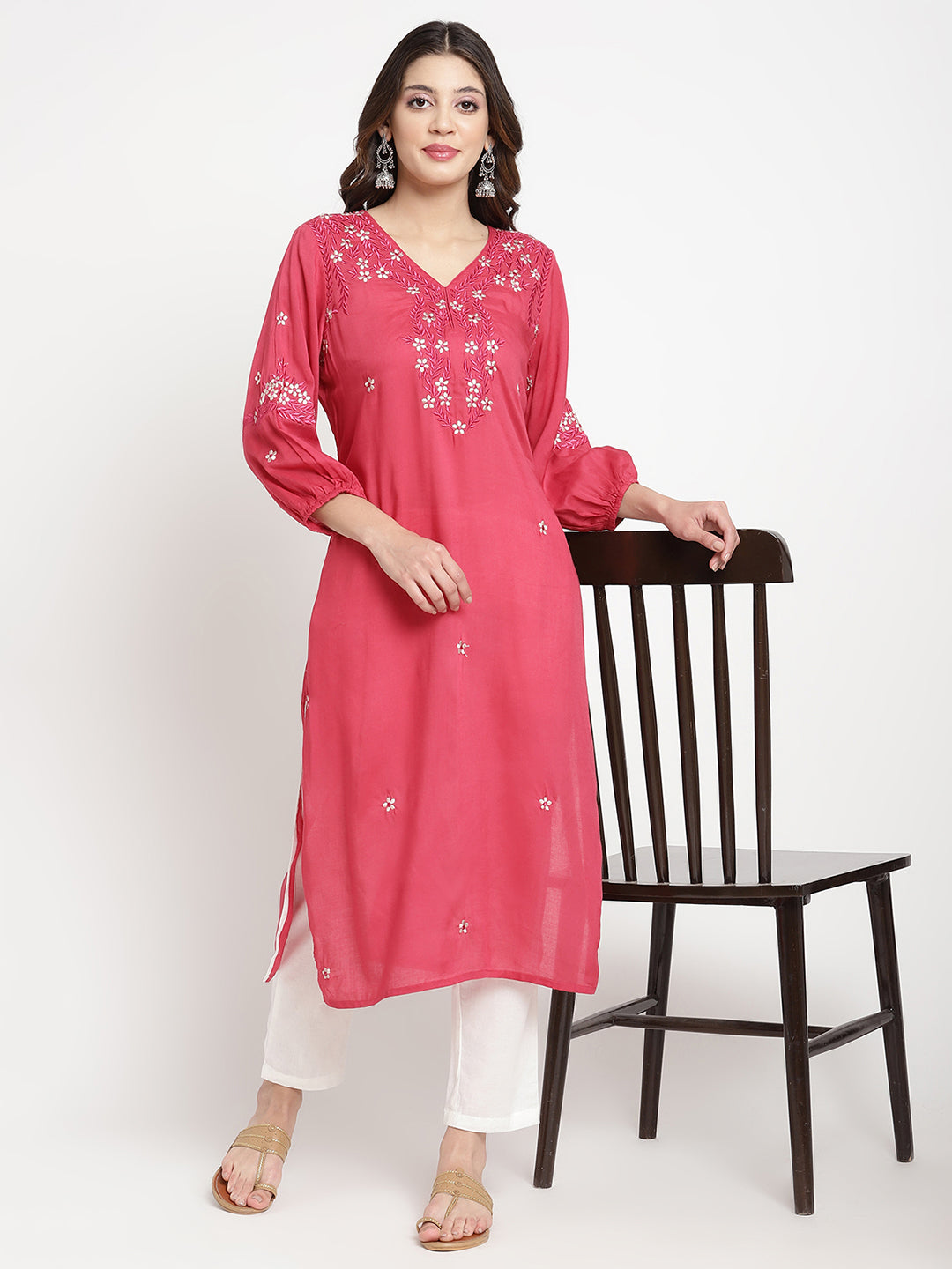 Woman standing in Rose Pink Embroidered A Line Kurta by Savi. 