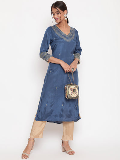 Woman posing in Blue Zari Embroidered Straight Kurta Pant Set