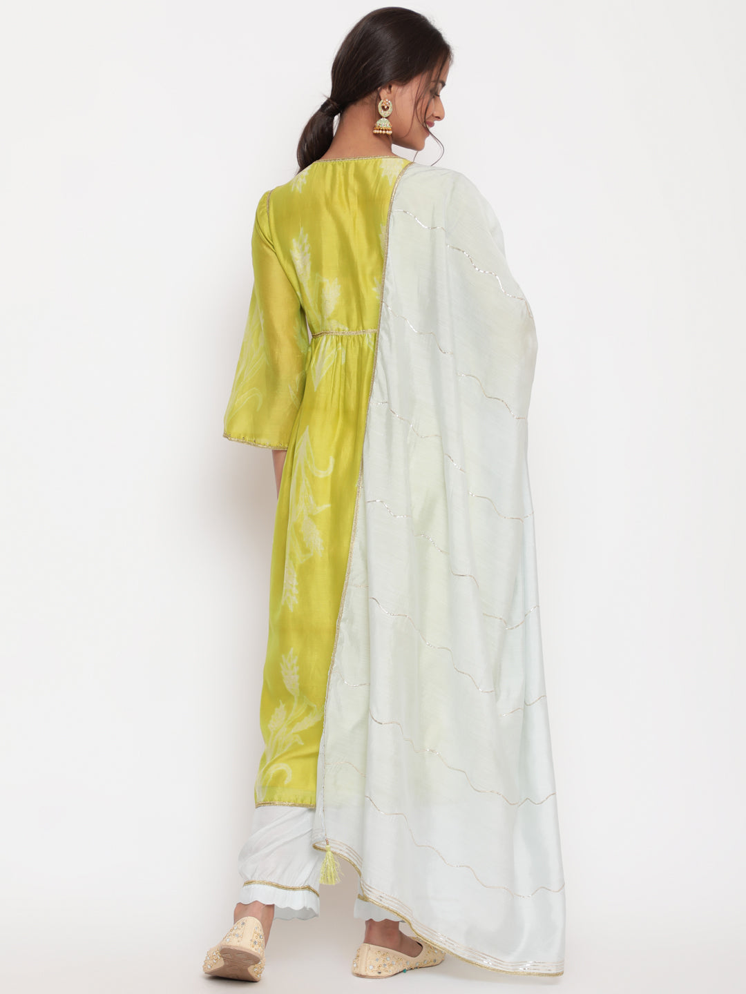 Woman posing in Lime Green Chanderi Silk Shibori Print Kurta pant set with Detailed Dupatta