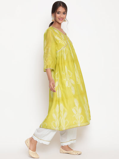 Woman posing in Lime Green Chanderi Silk Shibori Print Kurta pant set with Detailed Dupatta