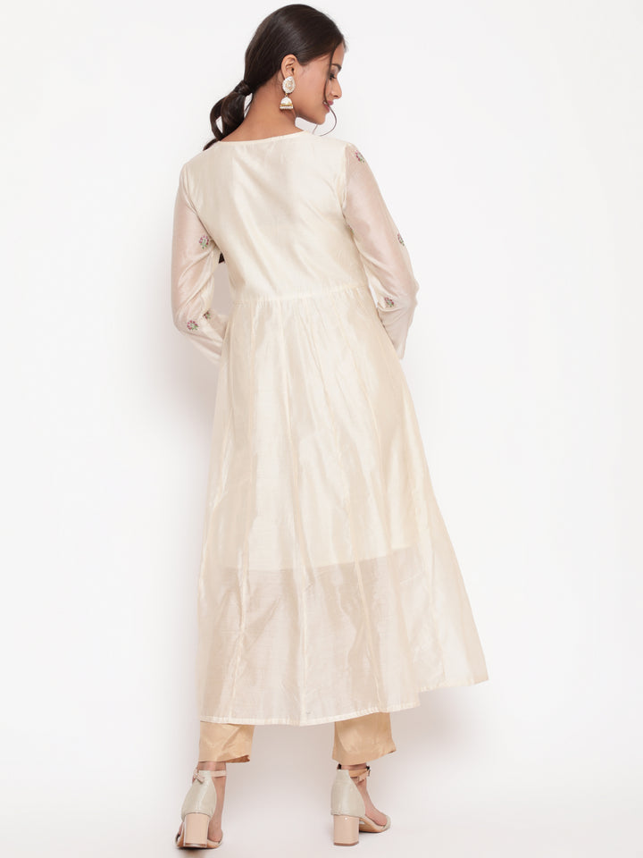 Woman posing in Savi's Silk Chanderi Ethnic Motif Embroidered Off White Angrakha Kurta