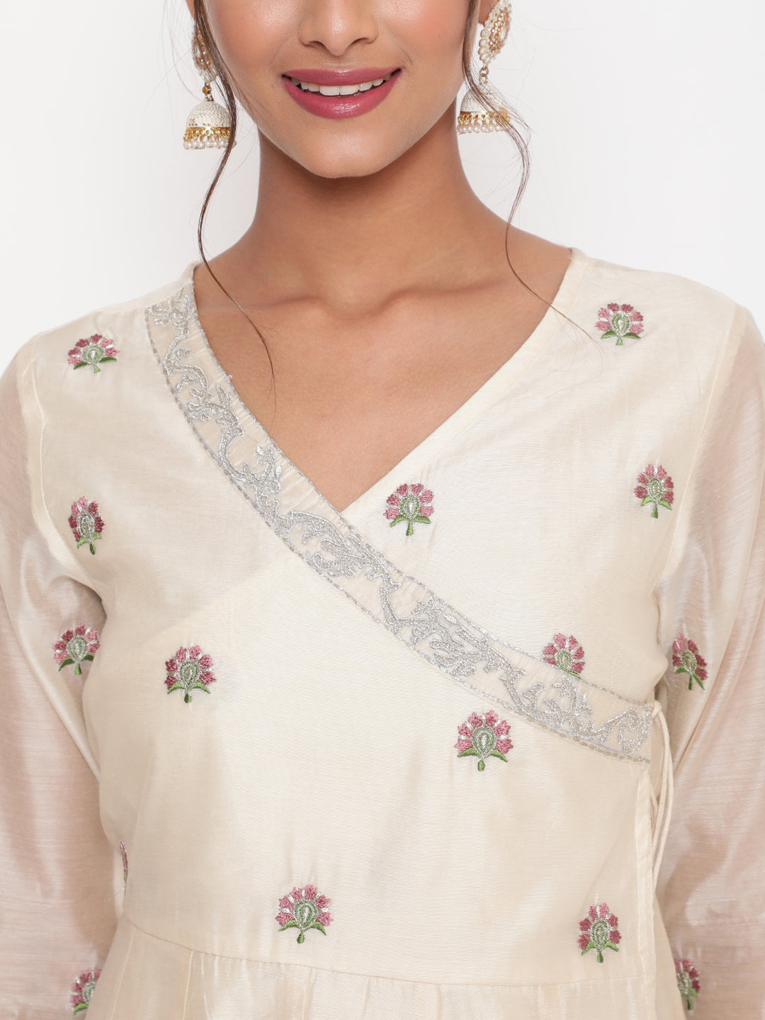 Woman posing in Savi's Silk Chanderi Ethnic Motif Embroidered Off White Angrakha Kurta