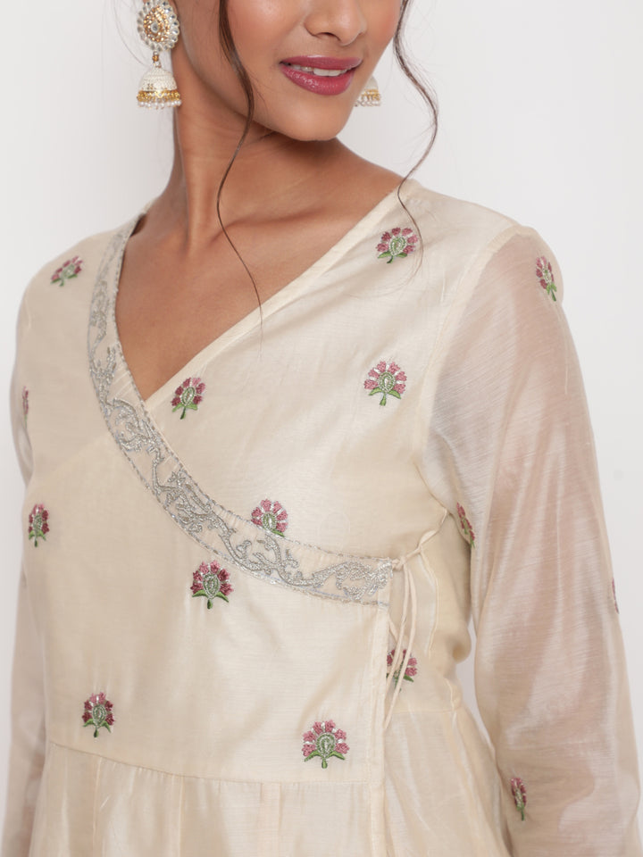 Woman posing in Savi's Silk Chanderi Ethnic Motif Embroidered Off White Angrakha Kurta